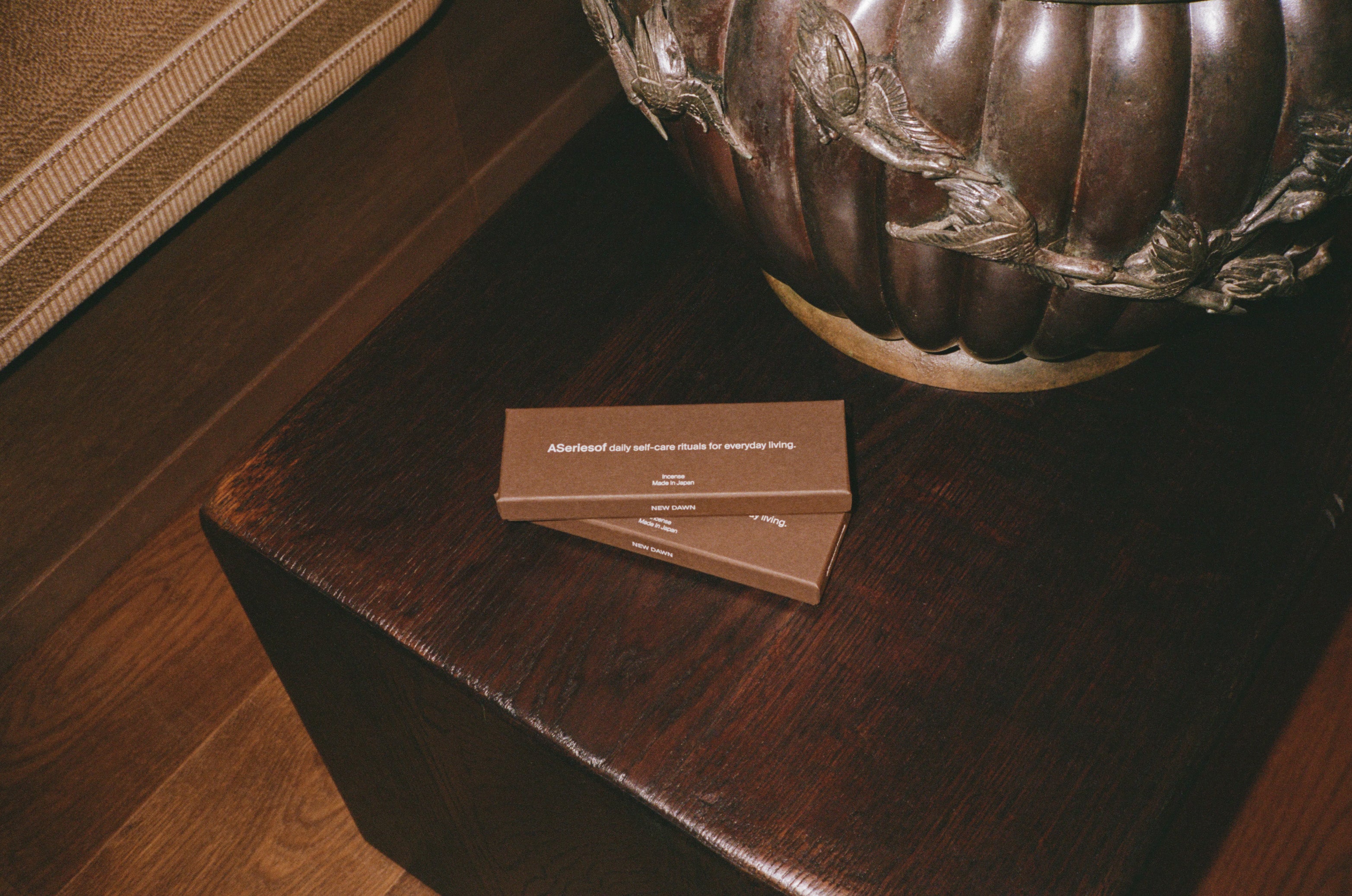 Japanese Incense sticks box made in Japan next to a statue in a luxury hotel.