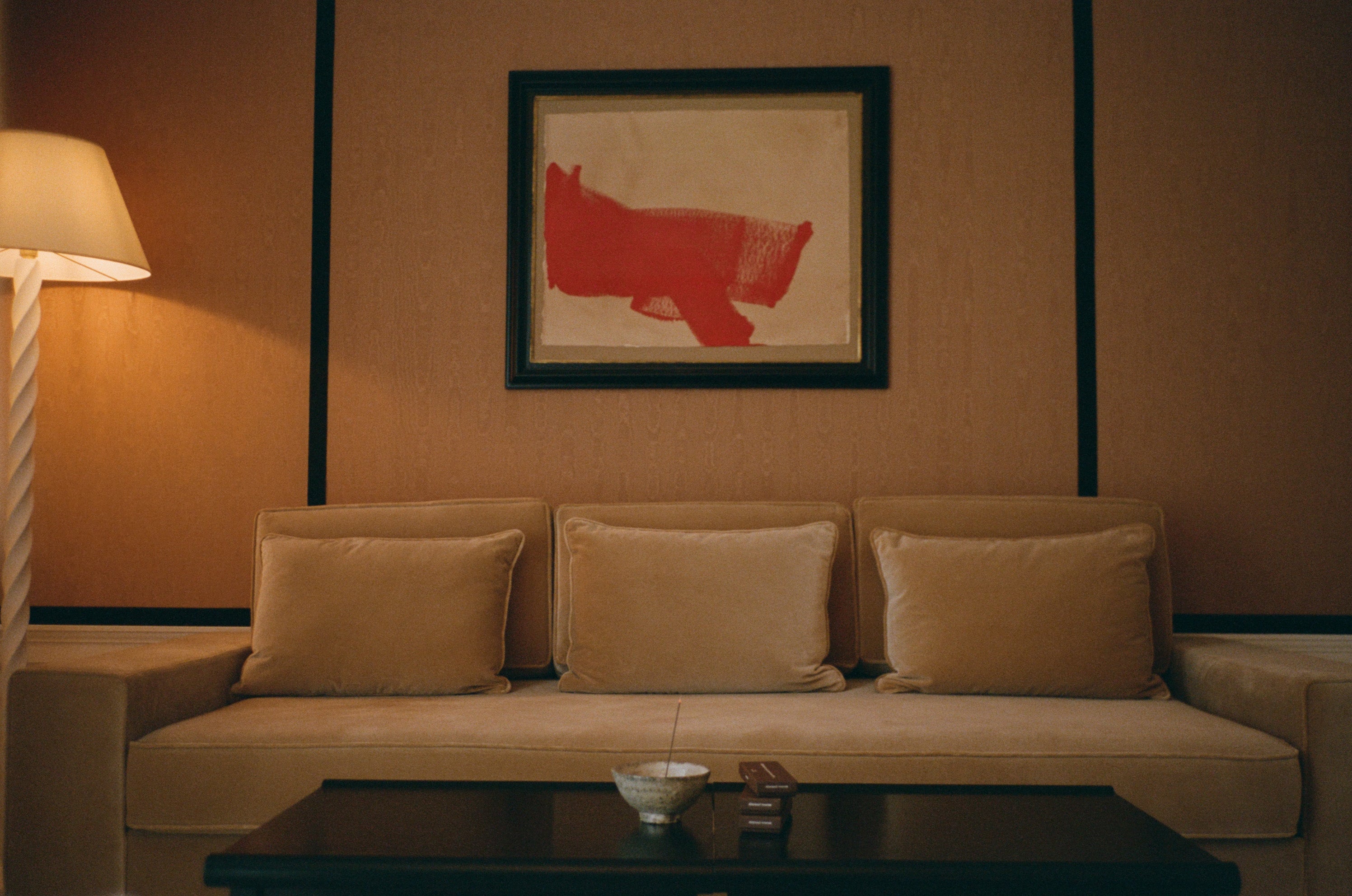 Japanese Incense sticks burning in a incense holder next to a stack of incense boxes made in Japan in a luxury hotel.