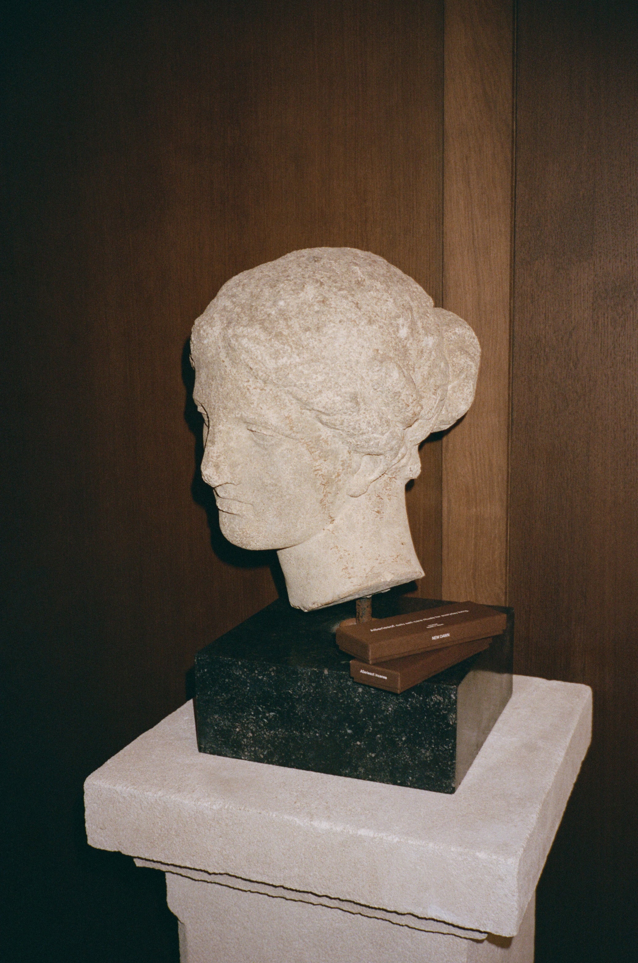 Japanese Incense sticks boxes made in Japan next to a statue in a luxury hotel.